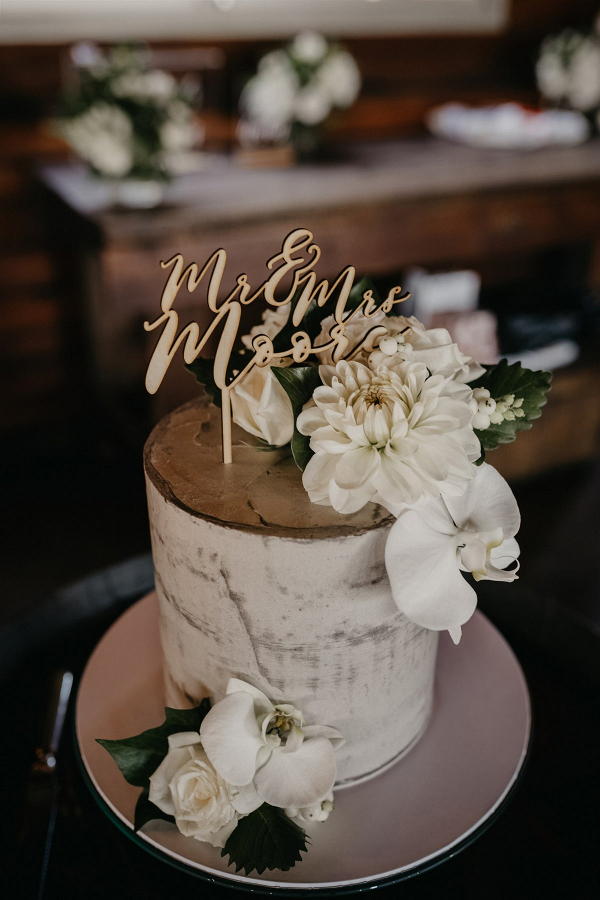 Semi naked wedding cake with laser cut topper