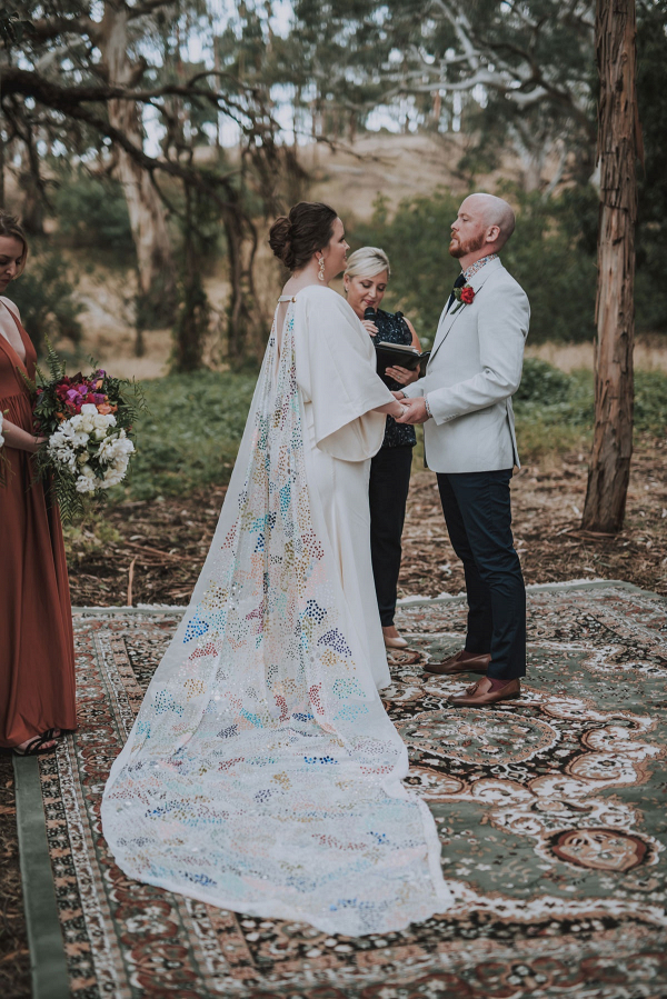 Bride with colorful sequin cape