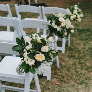 Peach Roses On White Chairs
