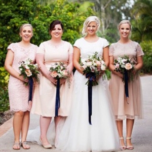 Bride With Bridesmaids In Peach And Navy