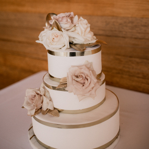 White wedding cake with gold trim