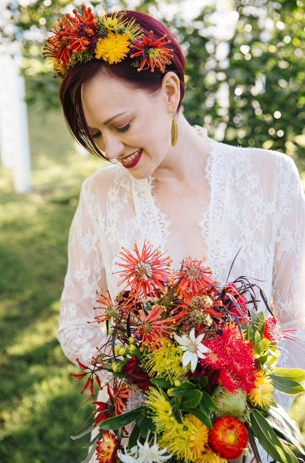 Bride with colorful floral crown and wild bouquet