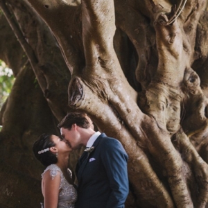 The Bride and Groom Under A Magnolia Tree