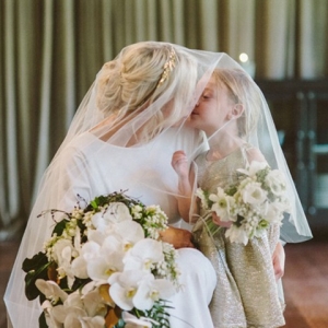Bride Kissing Flowergirl