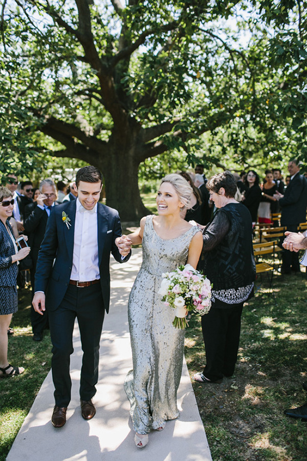 Newlyweds Recessional At Outdoor Wedding