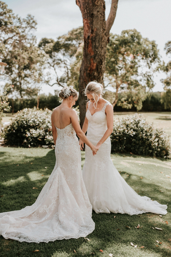 Two brides in lace wedding dresses