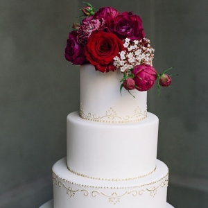 White Wedding Cake With Red Flowers