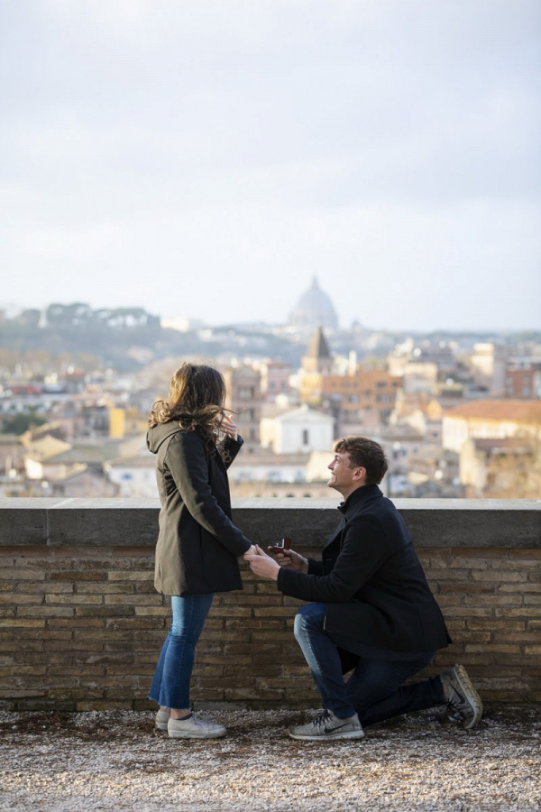 Rooftop proposal with urban Rome backdrop