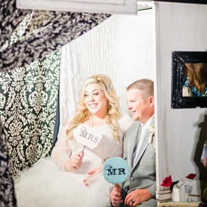 Plus Size Bride and Groom in Photobooth