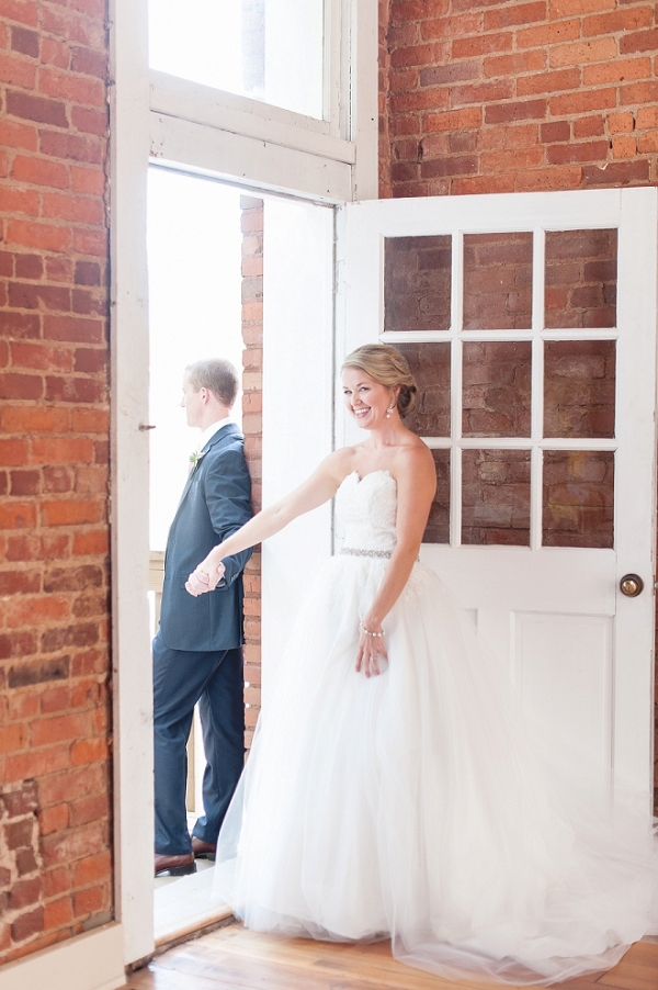 We're loving this super sweet first touch of the Bride and Groom in this darling DIY wedding!