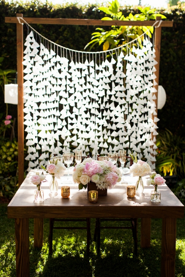 We're in LOVE with this Bride and Groom's beautiful handmade sweetheart table backdrop!