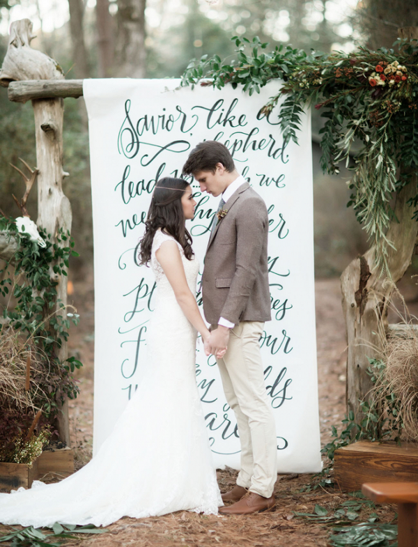 Check out this gorgeous hand lettered wedding ceremony backdrop!