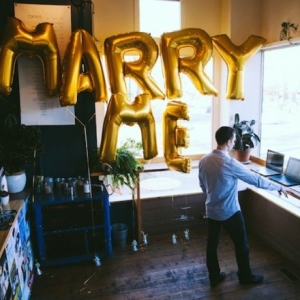 Super sweet surprise proposal with giant "marry me" balloons!