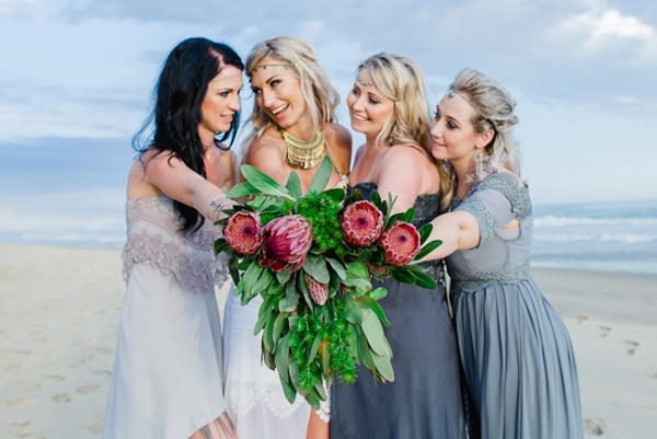 Bridesmaids with protea bouquets