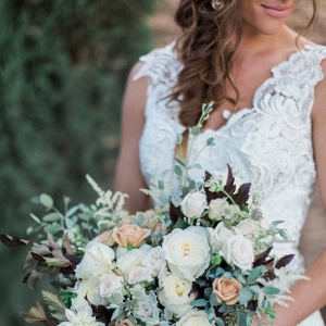 Bride in Lace Dress with Bouquet