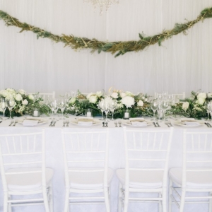 Classic tables with greenery garlands