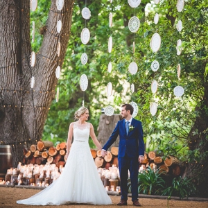Bride and groom with crochet dreamcatcher backdrop