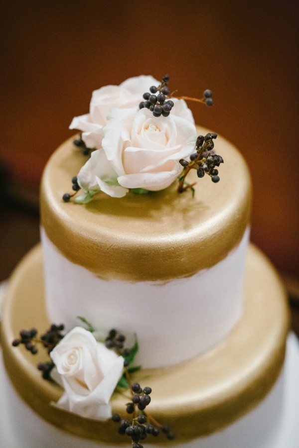 Gold wedding cake with berries