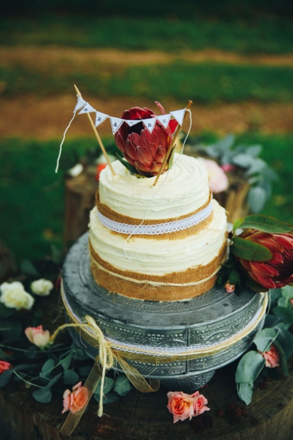 Rustic wedding cake with proteas