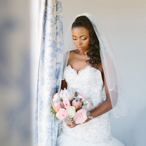 Bride with protea & rose bouquet