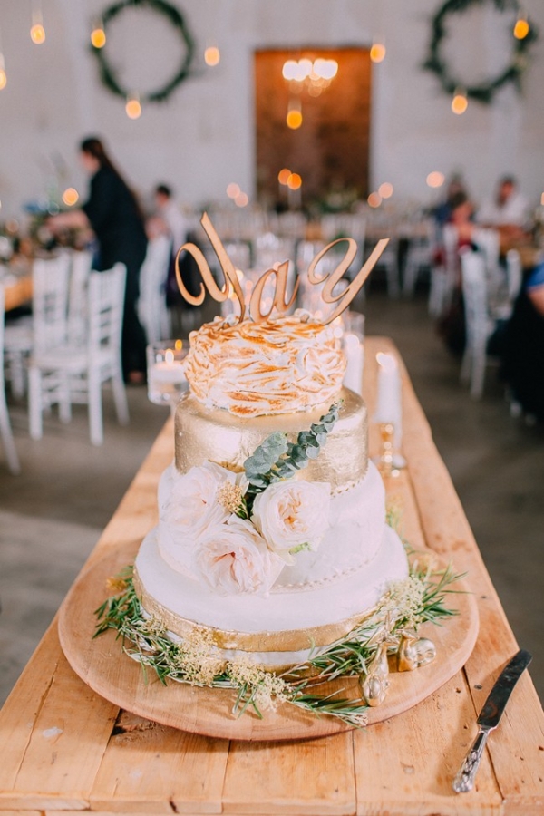 Gold wedding cake with 'yay' topper