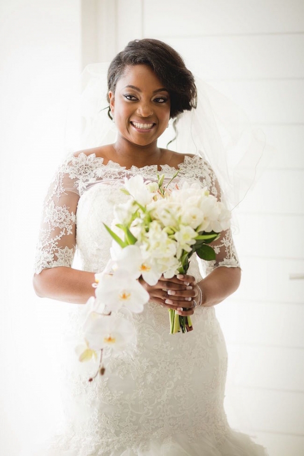 Bride in Lace Sleeve Dress with White Bouquet