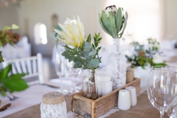 Rustic centerpiece with proteas and lace