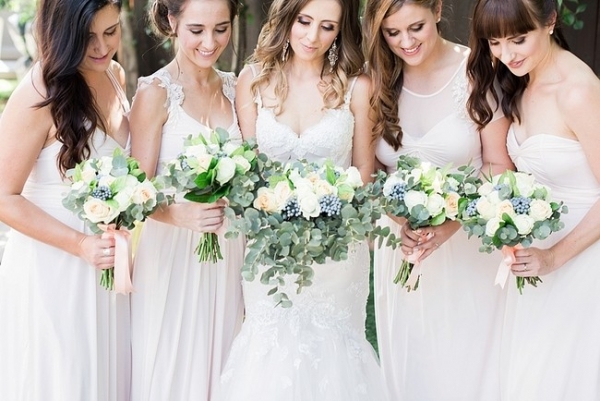 Bridesmaids in long white dresses