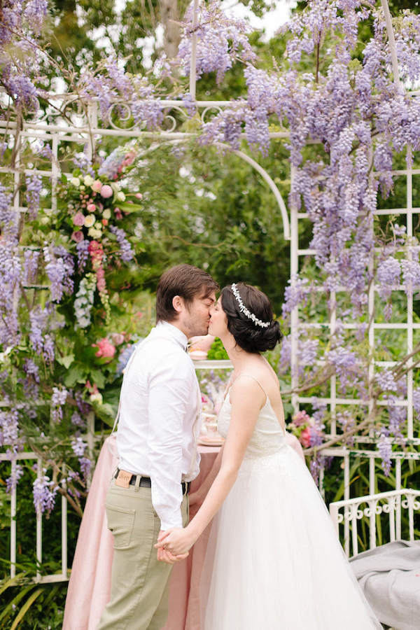 Bride and Groom Kissing in Garden