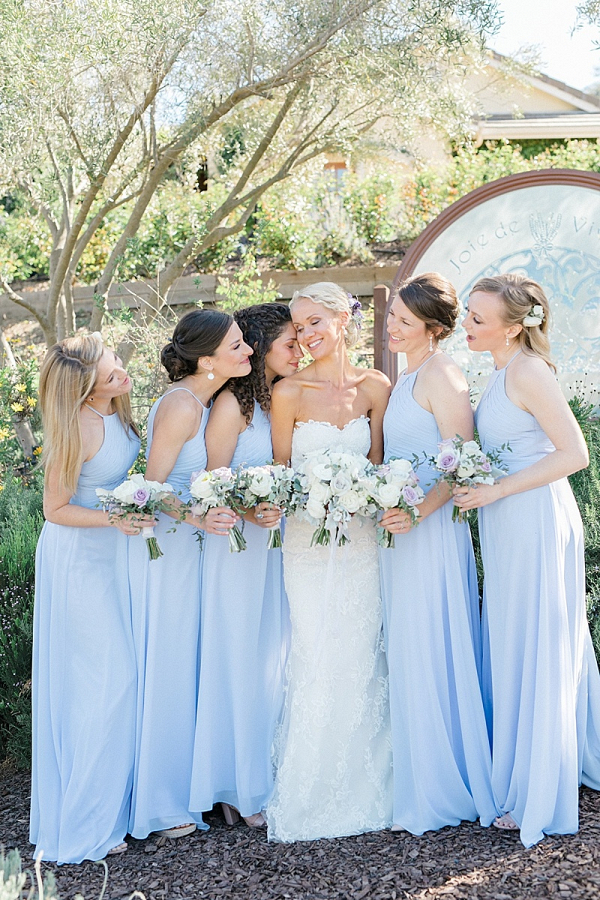 Bridesmaids in long light blue dresses