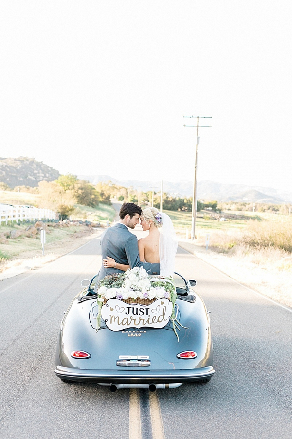 Wedding getaway convertible with just married sign