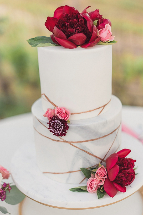 Marble wedding cake with peony topper