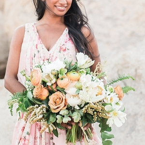 large peach and white floral bouquet with roses, tupils, ferns, and ranunculus