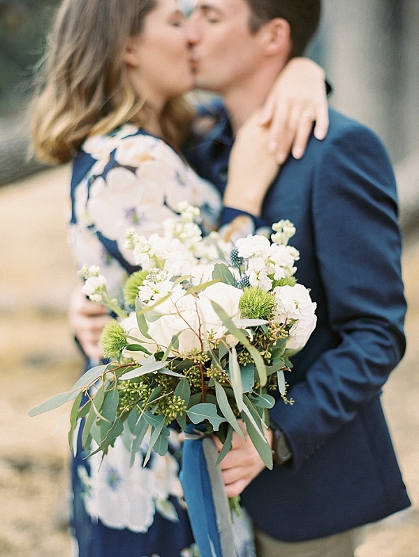 Engaged Couple holding bouquet