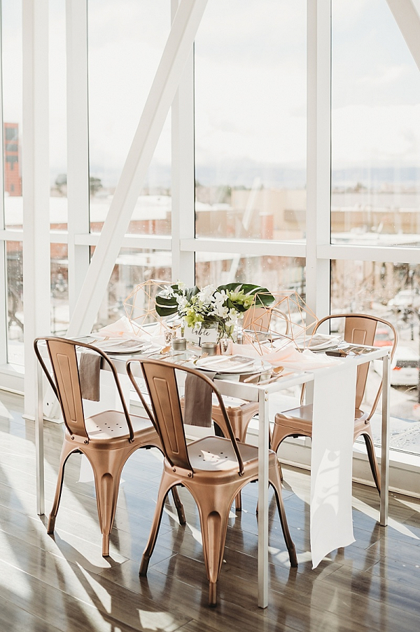 Modern copper and greenery wedding table