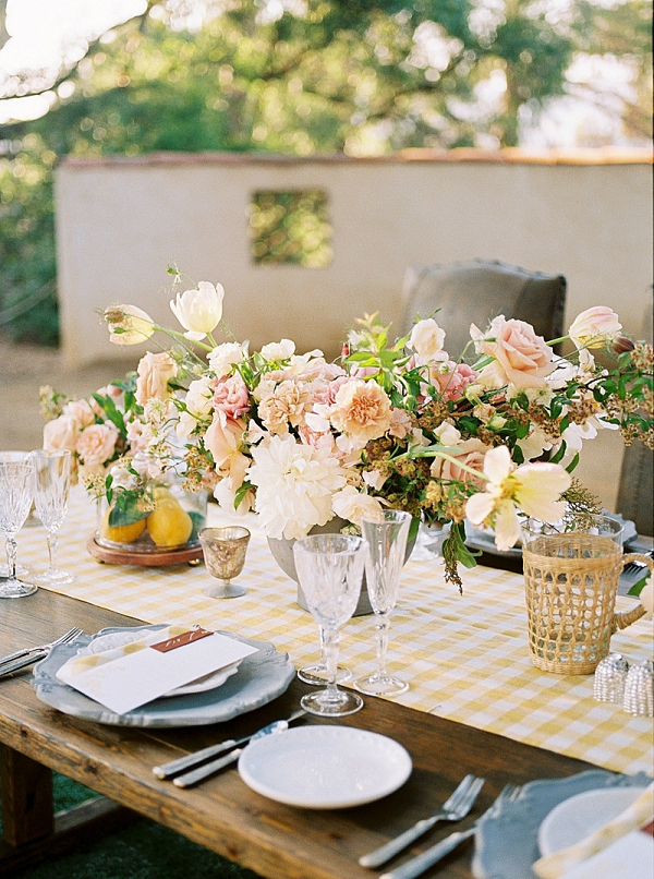 Summer yellow wedding table with gingham table runner