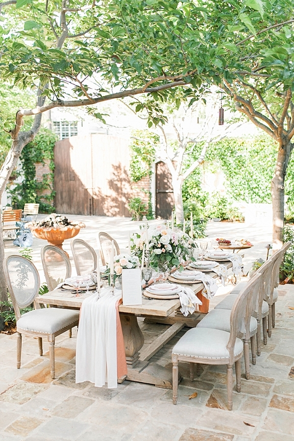 Romantic Tablescape with linen runner and candles at The Villa San Juan Capistrano