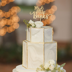 Marble wedding cake with gold topper