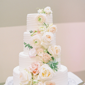 Classic blush flower covered wedding cake