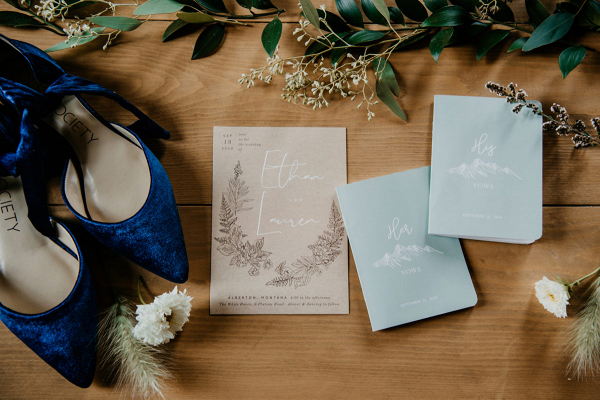 Blue bridal shoes and wedding invitations