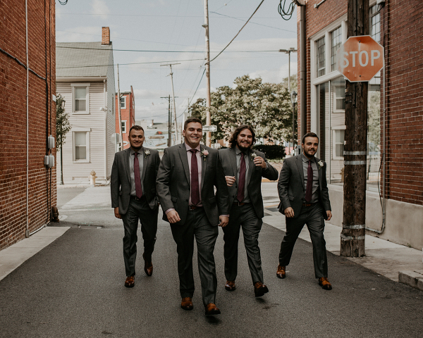 The groom and the groomsmen taking a stroll