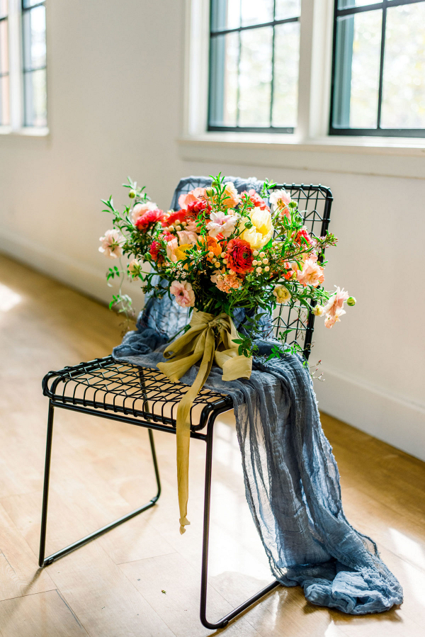 Aesthetic bouquet on black chair