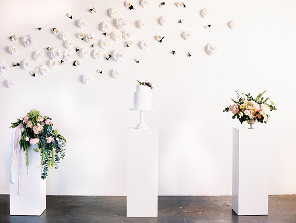 A gallery display of flowers and cake