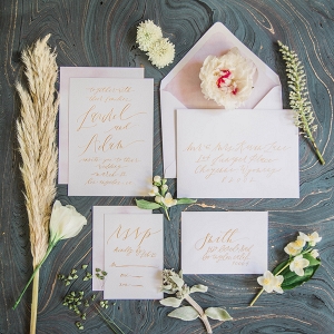 Simple invitation suite with organic calligraphy in muted gold