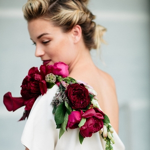 Red-and-fuchsia shoulder corsage