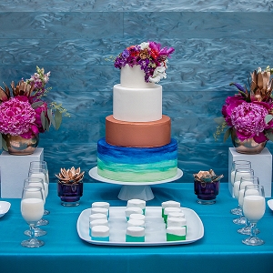 Copper and jewel-toned watercolor wedding cake