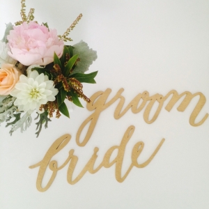 Laser-cut bride and groom chair signs