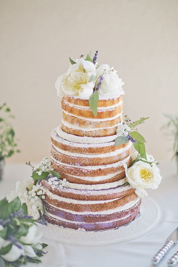 Lavender-infused ombre naked cake adorned with white peonies and sprigs of fragrant lavender