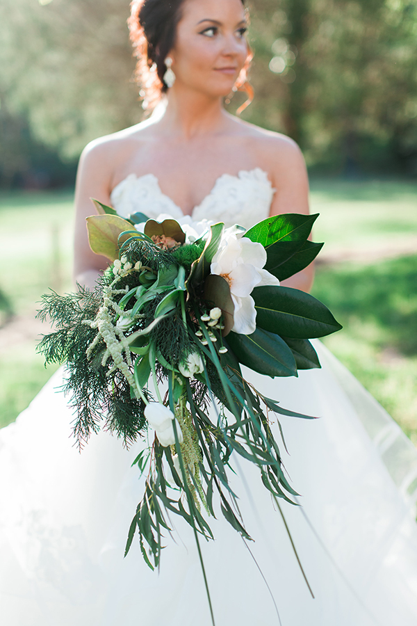 Southern bouquet with magnolias, tulips, and trailing greenery