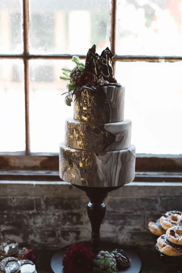 Marbled wedding cake with gold leaf